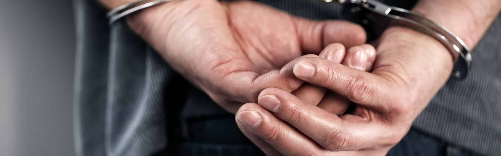 cropped image of man in handcuffs