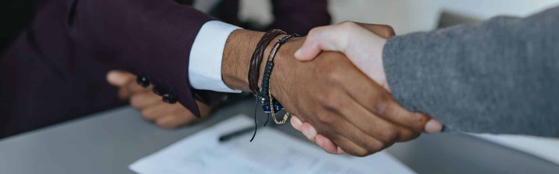 lawyer shaking hands with client