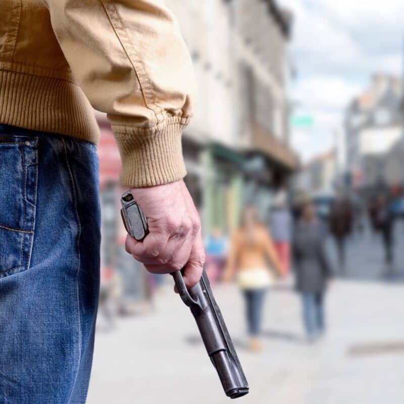 man holding a fire arm